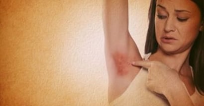 HS, woman pointing at under arm